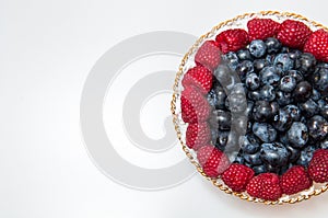 Fresh blueberry and rasberry on white background