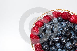 Fresh blueberry and rasberry on white background