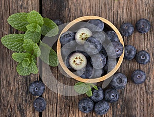 Fresh blueberry on wooden background