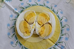 Fresh boiled chicken eggs with two yolks in the middle for breakfast