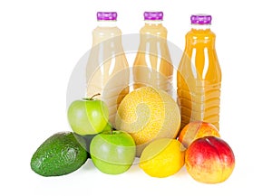 Fresh bottles of juice with fruits isolated on white