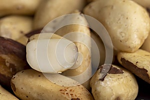 Fresh Brazil nuts peeled from the shell on the table
