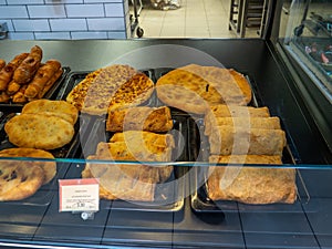 Fresh bread. Bakery products. Bread in the supermarket in stock. Pies on the counter