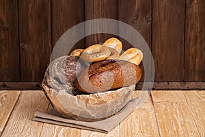 Fresh Bread In Bowl On Wooden Background With Texture