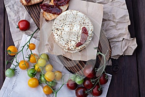 Fresh bread with dried tomatoes with olive oil and homemade bread. A traditional quick snack for home cooking