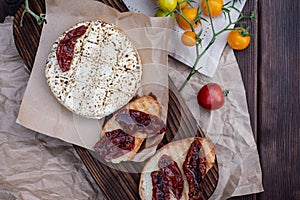 Fresh bread with dried tomatoes with olive oil and homemade bread. A traditional quick snack for home cooking