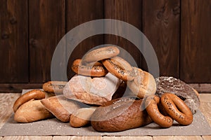 Fresh Bread On Napkin On Wooden Table