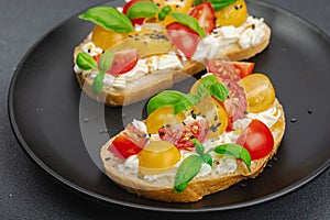 Fresh bread sandwiches with tomato cherry, cream cheese and basil leaves. Morning breakfast concept