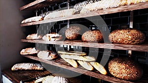 Fresh bread on shelves in bakery 24