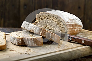 Fresh bread slice  on rustic table