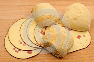 Fresh bread with slices of smoked cheese