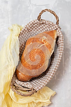 fresh bread in small backet on blue background