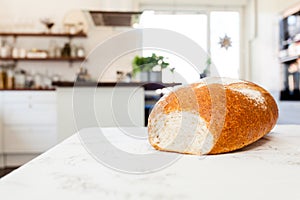 fresh bread on table kitchen in background