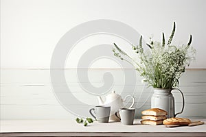 Fresh bread, tea cups, teapot, wild flowers. Minimalist Nordic Breakfast Spread