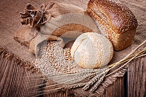 Fresh bread, wheat ears and grain