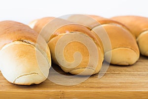 Fresh bread on a wooden table, arranged, shallow depth of field.