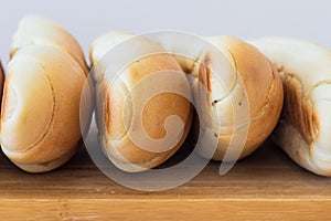 Fresh bread on a wooden table, arranged, shallow depth of field.