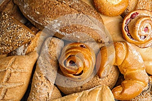 Fresh breads and pastries as background