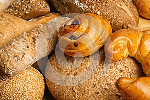Fresh breads and pastries as background,