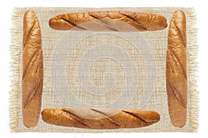 Fresh breads on sackcloth isolated on white background