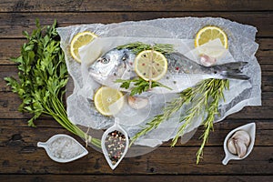 Fresh bream fish with herbs and spices ready to cook