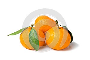 Fresh, bright fruits. Two tangerines with a leaf on a white isolated background