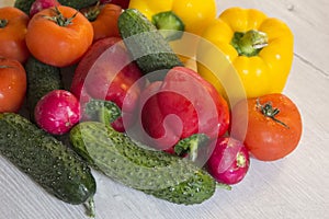 Fresh bright vegetables on a wooden table