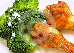 Fresh broccoli with chicken drums