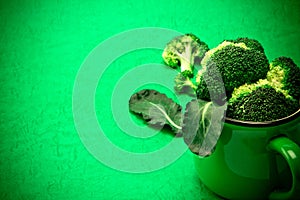 Fresh Broccoli on green background , nature green food concept