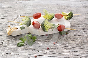 Fresh broccoli, juicy tomatoes on skewers