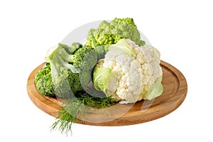 Fresh broccoli, romanesco and cauliflower on wooden board isolated on white