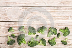 Fresh broccoli on white wooden background with copy space for your text. Top view