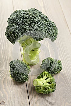 Fresh broccoli on wood board