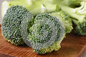 Fresh broccoli on wood cutting board