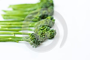 Fresh broccolini isolated on white background with copy space