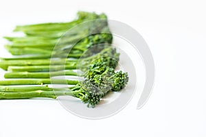 Fresh broccolini isolated on white background with copy space