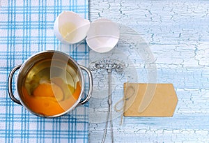 Fresh broken raw egg in pan