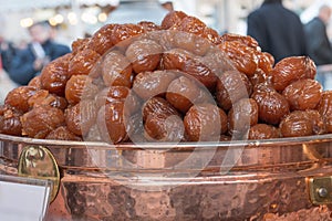 Fresh Brown Candied Chestnuts inside Copper Bowl