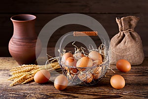 Fresh brown eggs in a basket