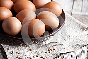 Fresh brown eggs in a bowl