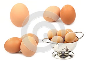 Fresh brown eggs and some in a metal colander