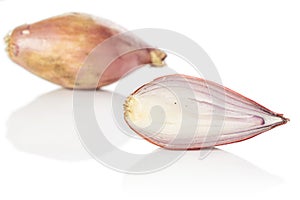 Fresh brown shallot isolated on white