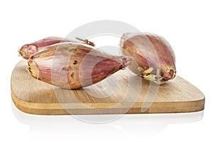 Fresh brown shallot isolated on white
