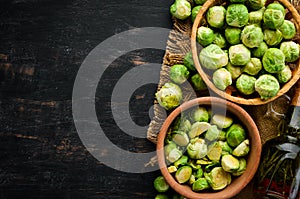 Fresh Brussels cabbage on a black background. Vegetables.