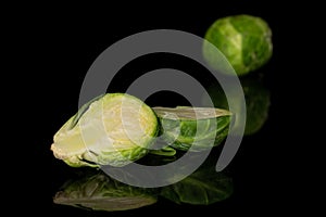 Fresh brussels sprout isolated on black glass