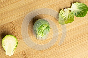 Fresh brussels sprout on light wood