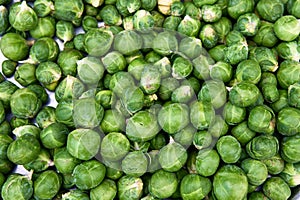 Fresh brussels sprouts in an enameled bowl, view from above