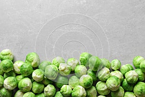 Fresh Brussels sprouts on grey background, top view