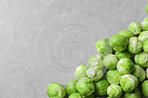 Fresh Brussels sprouts on grey, top view with space for text