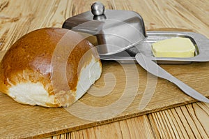 Fresh bun on a wooden surface